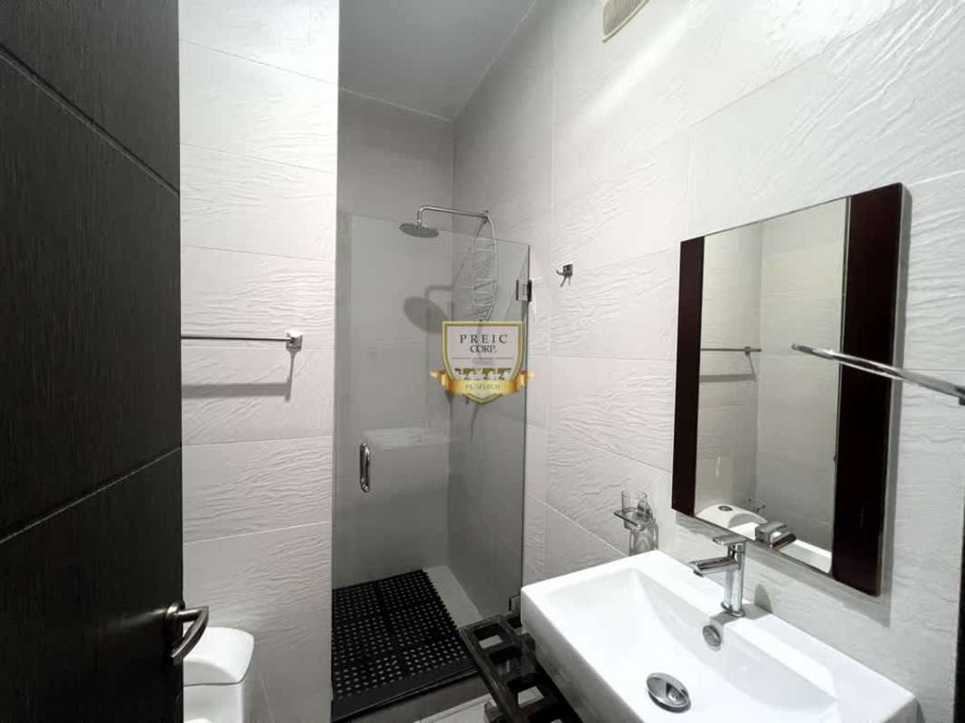 Open concept kitchen with appliances granite counters at PH Element Tower Panama City