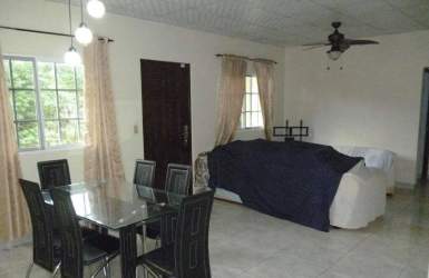 Spacious open plan living dining tiled floors large windows ceiling fan David Panama