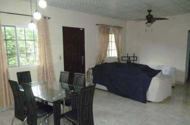 Spacious bedroom with AC unit, tiled floor, closet, windows with curtains in San Vicente David Panama