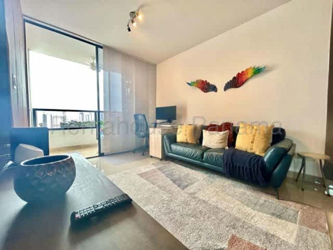 Open-plan living-dining room with wall-mounted TV Canvas Tower Panama