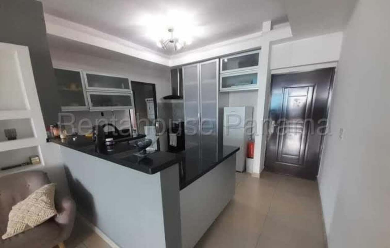 Modern kitchen with granite top and open dining area PH Terrazas del Parque Panama