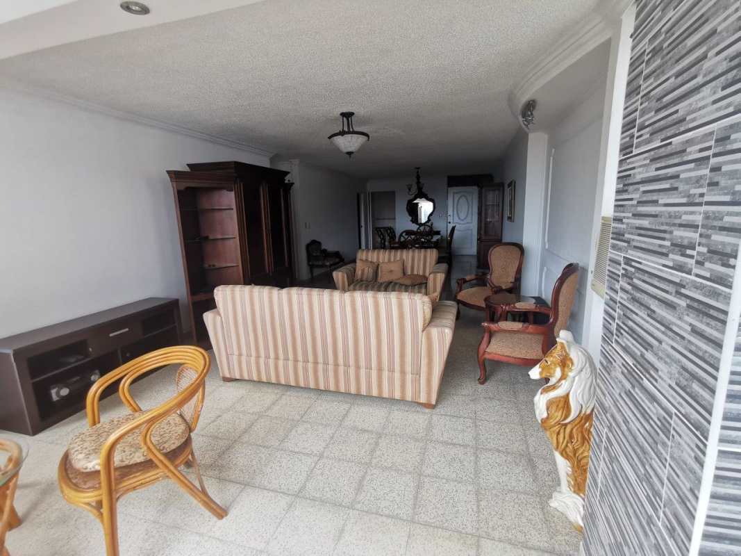 Long white hallway with console mirror in large apartment PH Fuente de los Cibeles Betania Panama