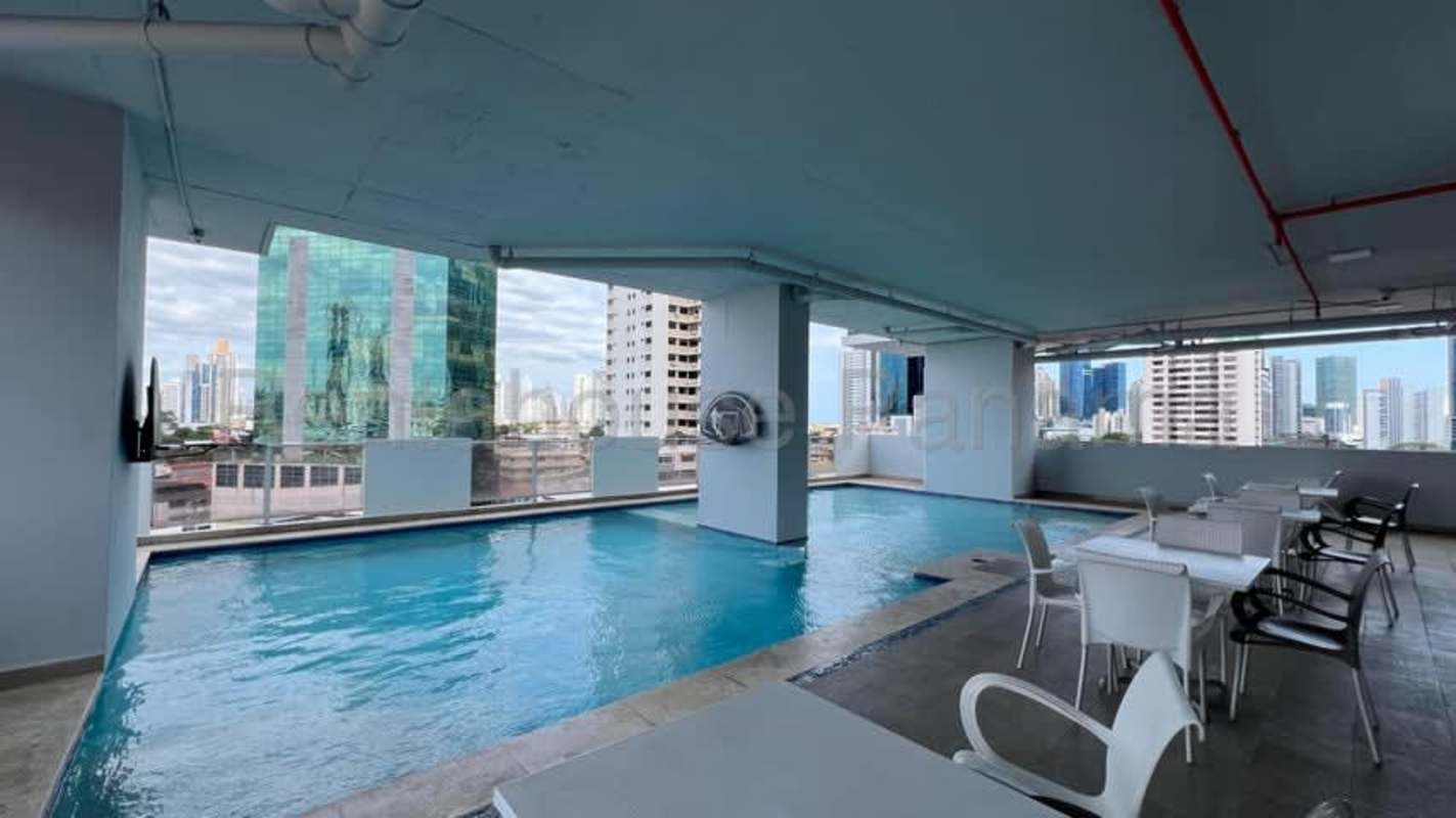 Spacious living room with porcelain floors, large windows and balcony access PH Obarrio Tower Panama City
