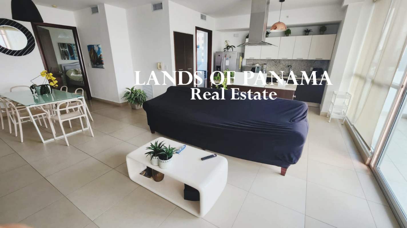 Spacious living dining area with open kitchen and floor-to-ceiling windows in PH Oceanaire