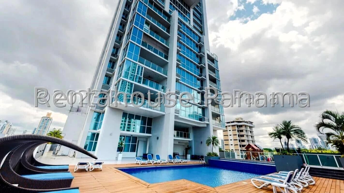 Outdoor pool with deck and skyline view at PH Greenview Panama City
