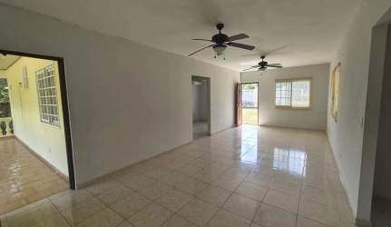 Living room with tiled floor, ceiling fans and windows in Sajalices country house