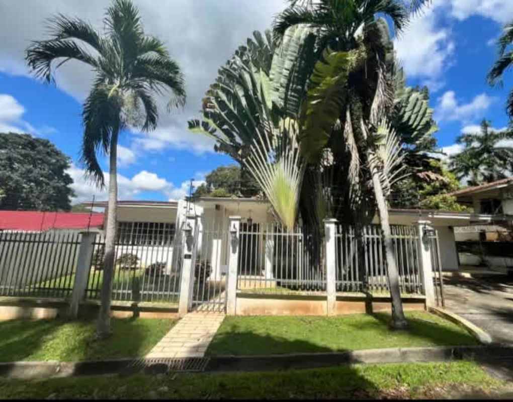 Dining room with exposed beams and wood furniture in Llanos de Curundu Panama City