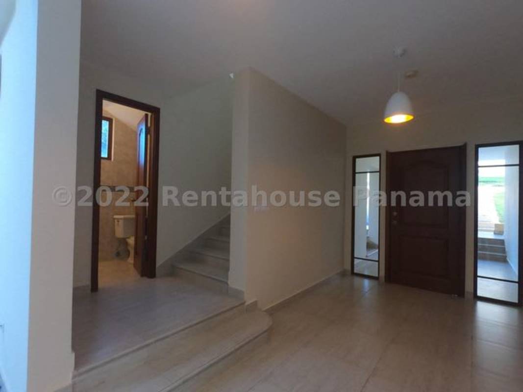 Spacious entry foyer with large tile floors and staircase Clayton Panama luxury home