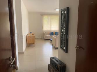 Remodeled modern kitchen with granite countertops and stainless appliances in River Valley Panama Pacifico apartment for rent