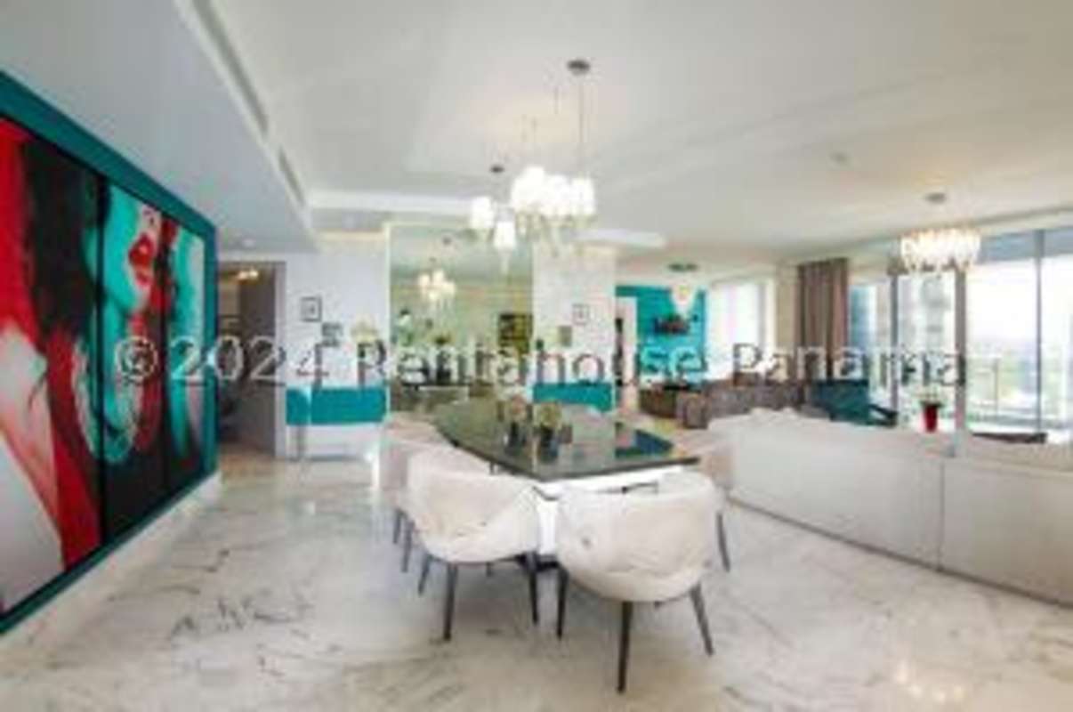 Spacious open living dining area marble floors with floor-to-ceiling windows at PH Regalia Costa del Este