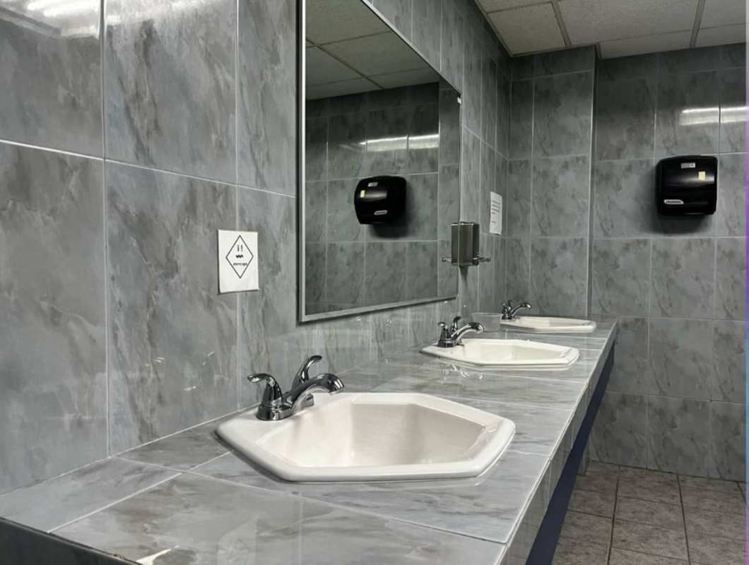 Triple sink bathroom with marble walls PH Obarrio Business Center Panama City