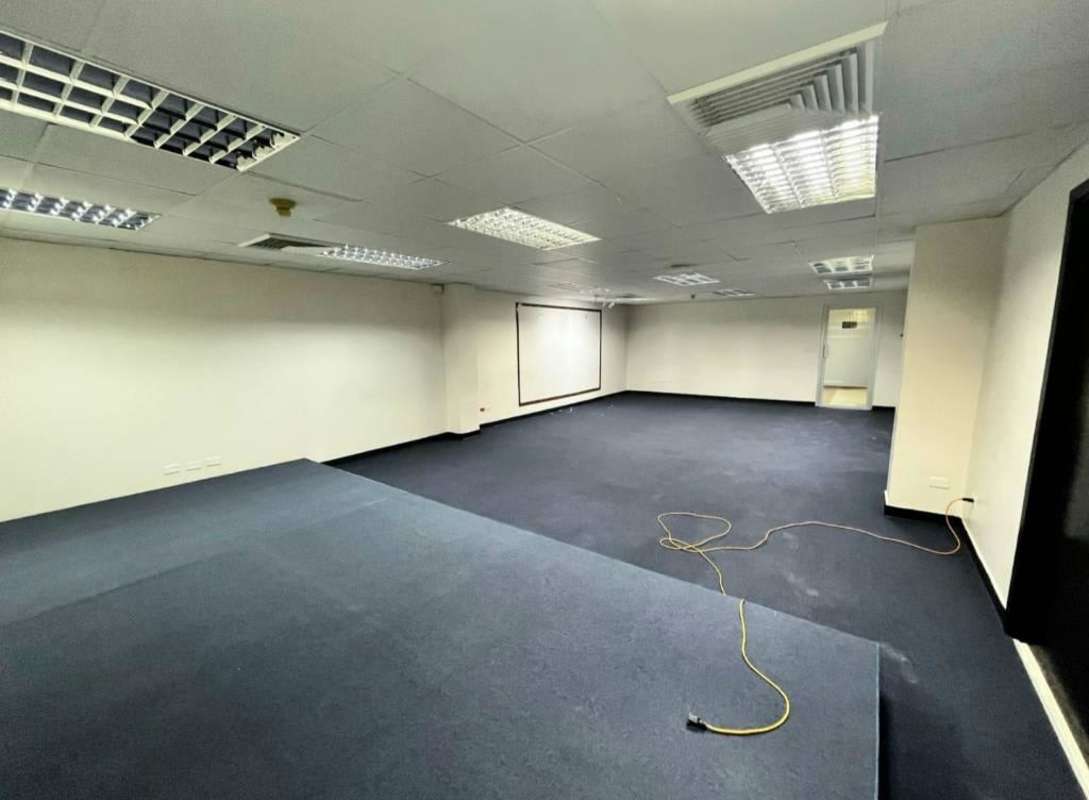 Spacious conference room with raised platform and screen in PH Obarrio Business Center Panama City