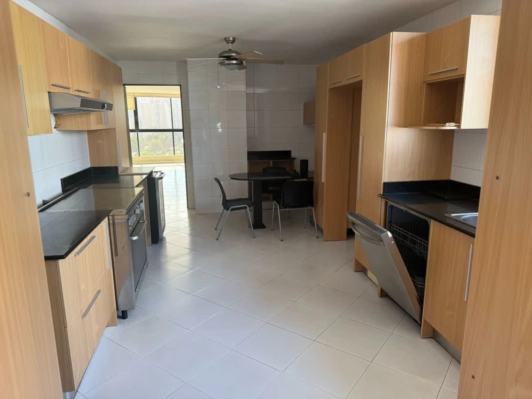 Living room with tile floors, large window and access to balcony in PH La Fontana Obarrio Panama