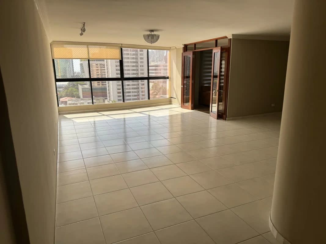 Kitchen with wood cabinets, black granite countertops, stainless steel appliances in PH La Fontana Obarrio