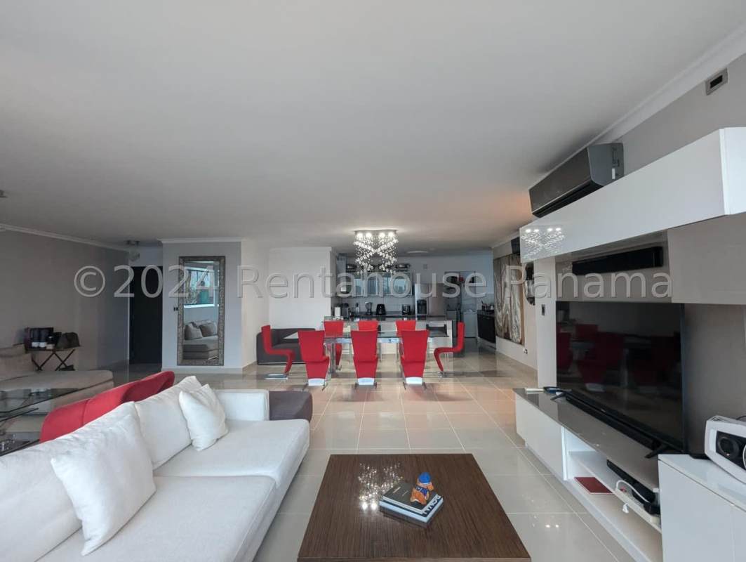 Modern kitchen and dining with granite countertops and glass table in PH Waterfalls San Francisco Panama