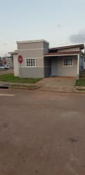Modern single-story house corner lot green lawn paved sidewalk Nuevo Emperador Arraiján
