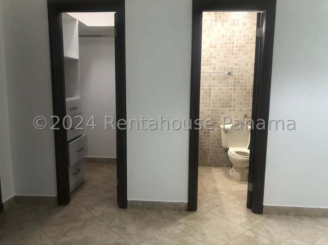 Large balcony with glass railing, ocean and skyline views in Punta Pacífica Panama