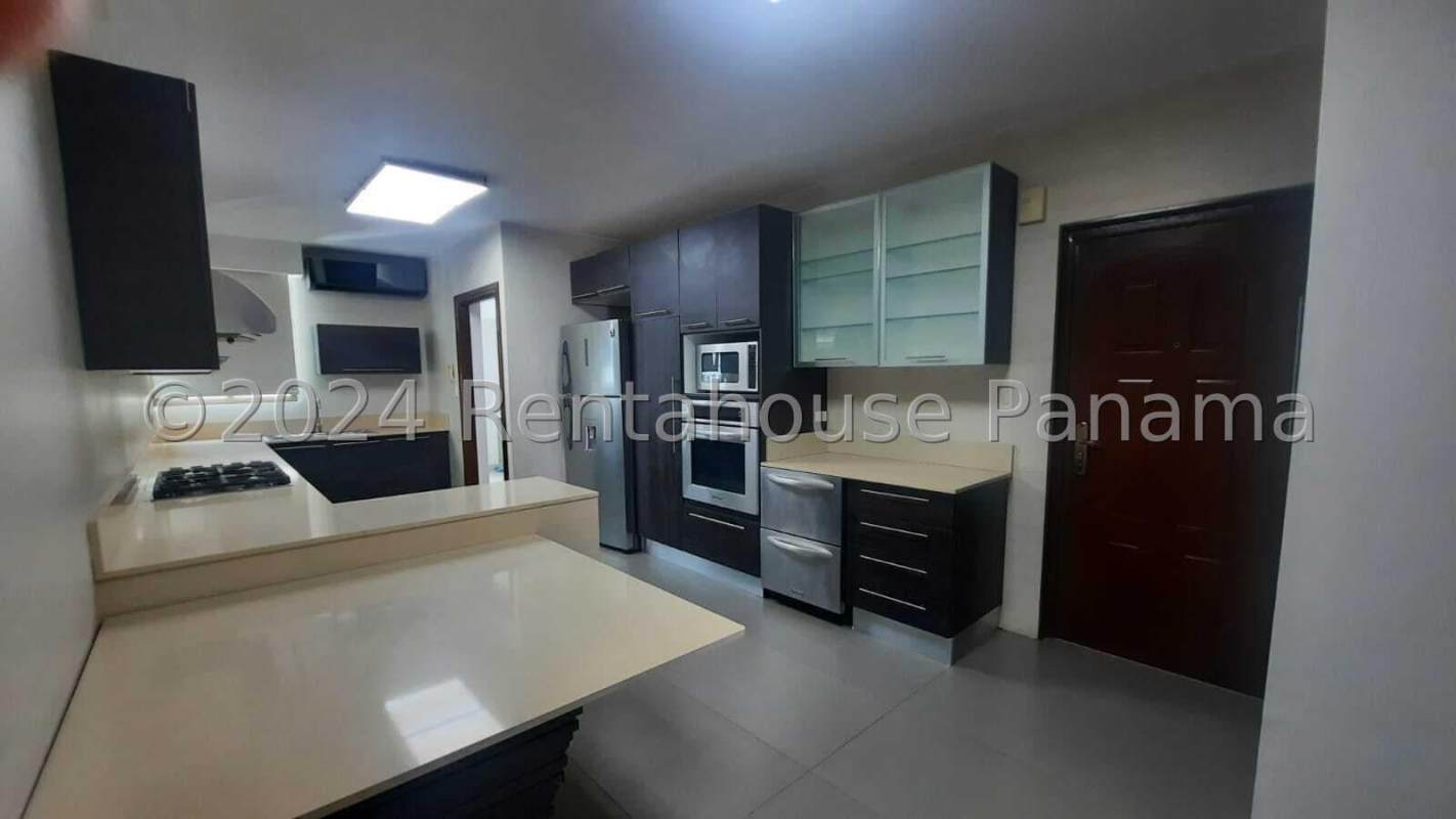 Elegant master bedroom with ocean view and large window in Ocean Reef Residences Panama