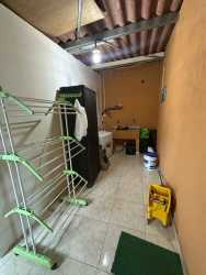 Bright bedroom with window and tile floor in Villa Karla Arraijan house sale