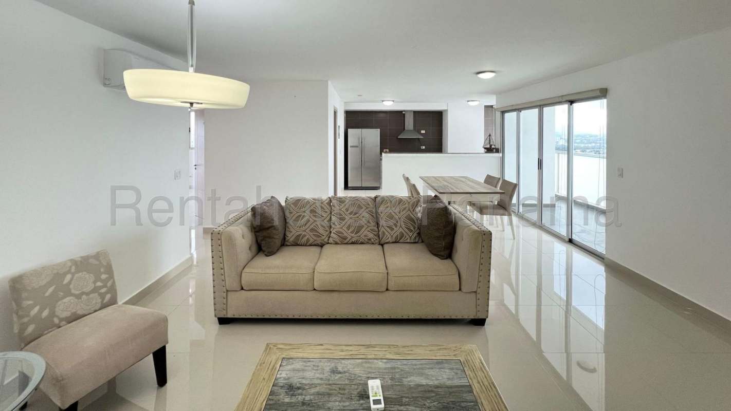 Second bedroom with window view of city skyline and ocean in PH Moon Tower Panama City