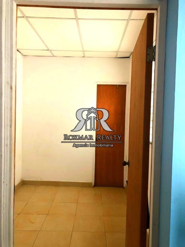 Traditional kitchen with wood cabinetry marble counter Brisas del Golf Panama