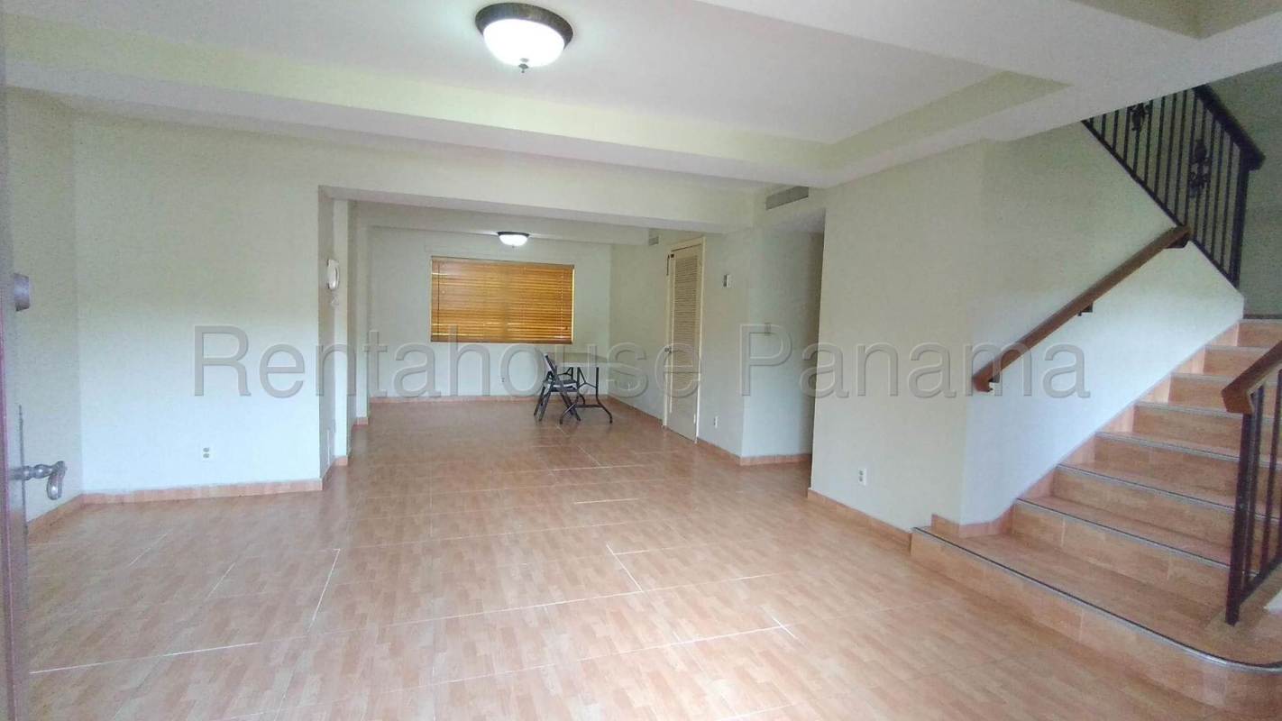 Covered terrace with columns and garden view in spacious Clayton Panama home for rent