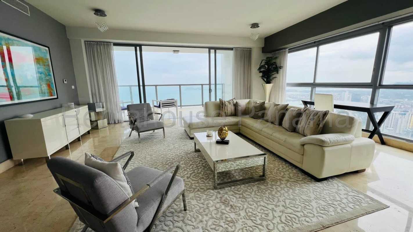 Elegant penthouse kitchen at Yoo Panama featuring large island and luxury appliances with ocean view windows