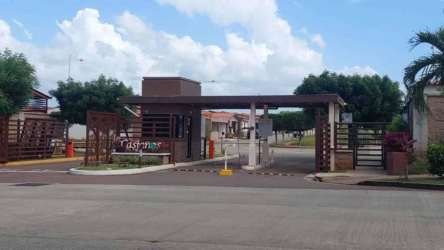 Gated entrance with security booth Arboledas Residences La Chorrera Panama