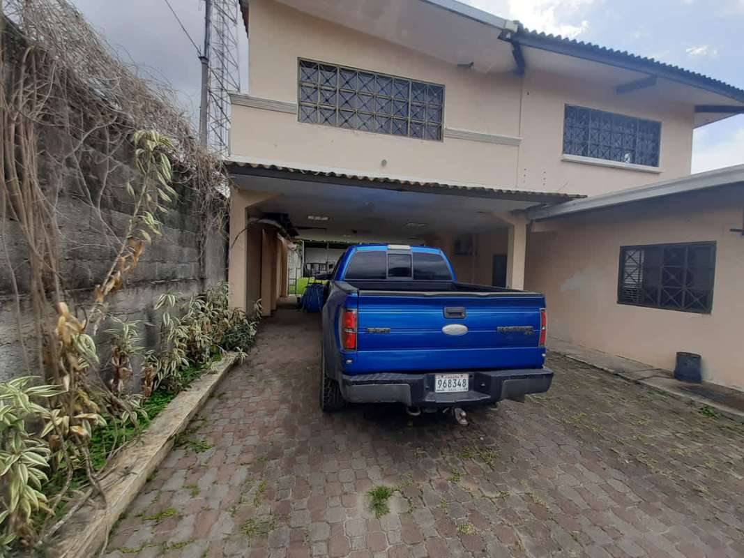 Kitchen with wooden cabinetry and appliances Villas de las Acacias Panama house