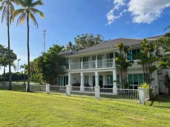 Open plan living room with golf views and private terrace in Bijao Beach Residences Panama