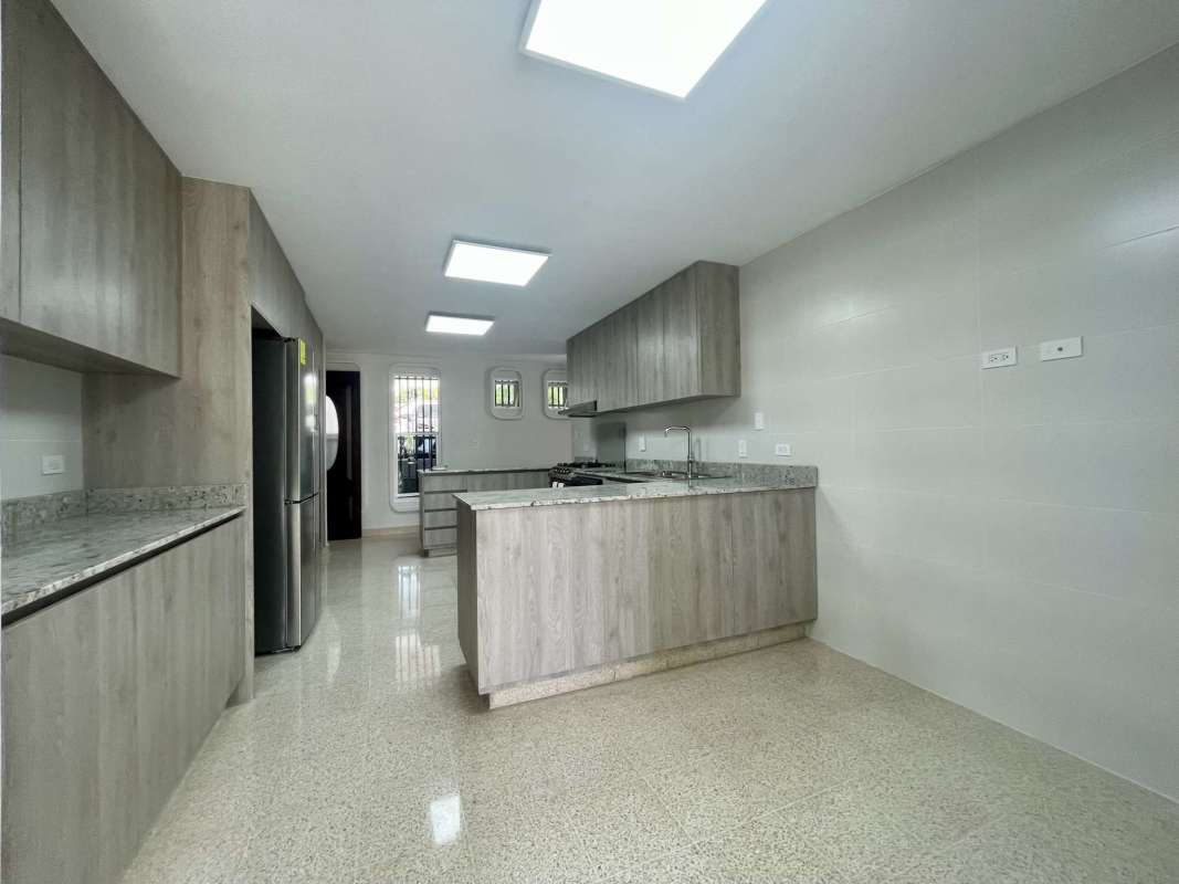 Large gourmet kitchen with granite counters, island, stainless steel appliances Loma Alegre Panama