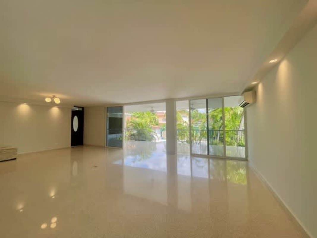 Modern kitchen featuring marble countertops, wooden cabinetry, stainless appliances Loma Alegre
