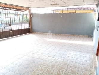 Kitchen area featuring MDF cabinets and integrated breakfast bar in Vacamonte house Panama