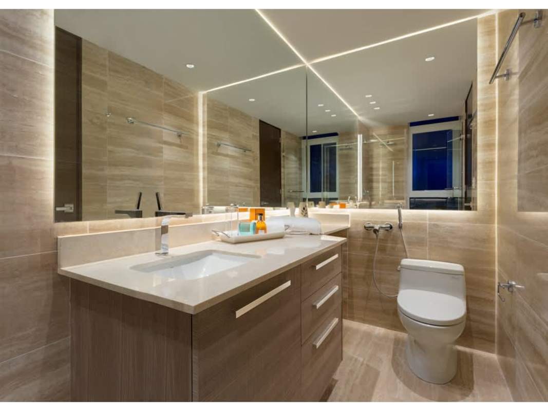 Furnished master bedroom with king bed, sea views, and ensuite bath in Costa del Este Panama