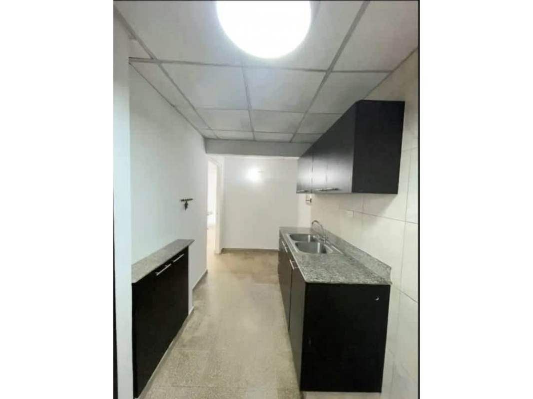 Kitchen with granite countertops black cabinets tiled walls Cerro Viento house Panama