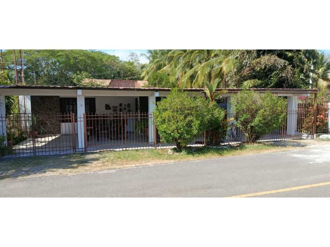 Single-story house with lush garden and fencing on corner lot Pacora Panama