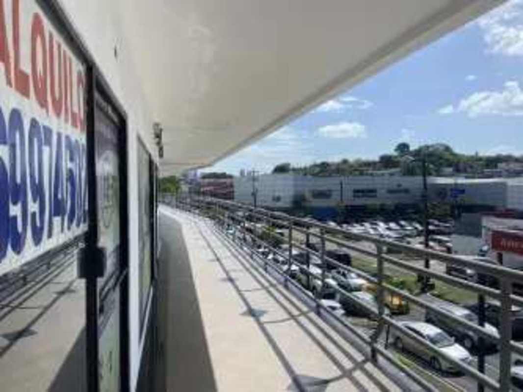 Balcony walkway overlooking parking lot city shopping urban commercial plaza El Dorado Panama City