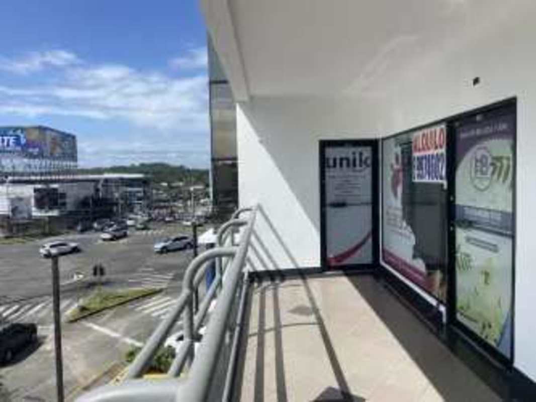 Commercial balcony with glass storefront parking street view Plaza Aventura El Dorado Panama