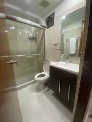 Bathroom with glass shower and vanity in PH Woodlands Panama Pacifico