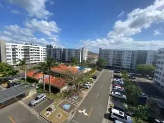 Aerial view of PH Woodlands residential buildings with pool and greenery Panama Pacifico