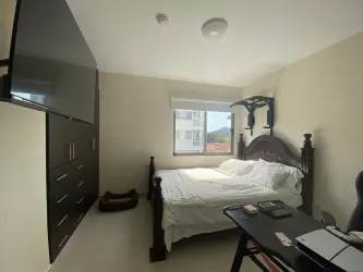 Bedroom setup with bed, closet and workspace PH Woodlands Panama Pacifico rental