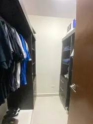 Spacious walk-in closet with shelving and drawers PH Woodlands Panama Pacifico