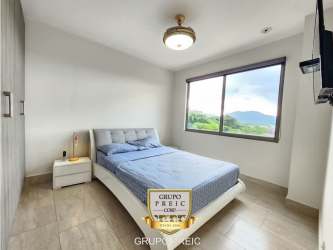 Bright living dining area with balcony access PH Explora Panama Pacifico