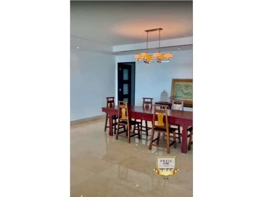 Contemporary kitchen with island, granite countertops, wood cabinets in PH Mirador Costa del Este Panama