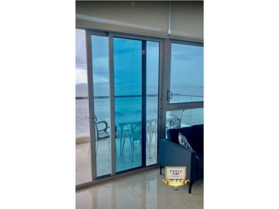 Living room in luxury apartment with floor-to-ceiling windows and oceanfront view PH Mirador Costa del Este