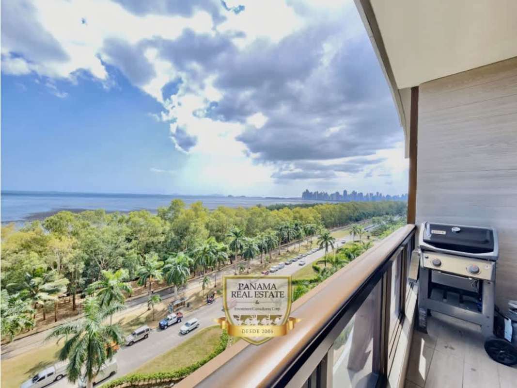 Elegant living dining area with marble floors, panoramic windows and city skyline views in PH Panama Bay Costa del Este Panama