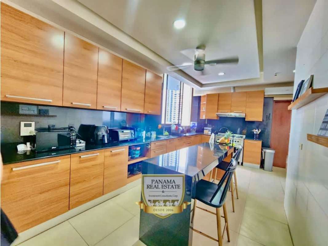 Colorful playground and mini soccer field surrounded by high-rise PH Panama Bay in Costa del Este Panama