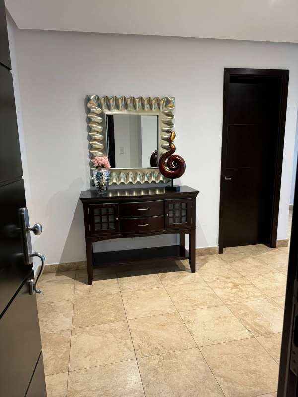 Master bedroom with large window, en-suite bathroom, city and ocean views in PH Titanium Panama