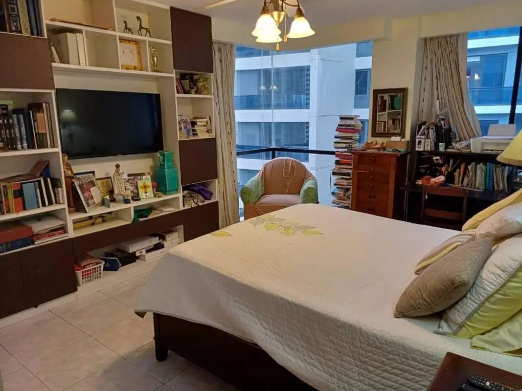 Master bedroom with built-in shelves and large window PH Royal Princess Punta Paitilla Panama