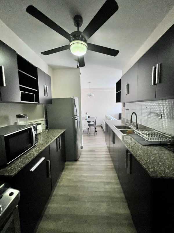 Second bedroom with closet, AC, window and simple furnishings at PH Doral Panama City